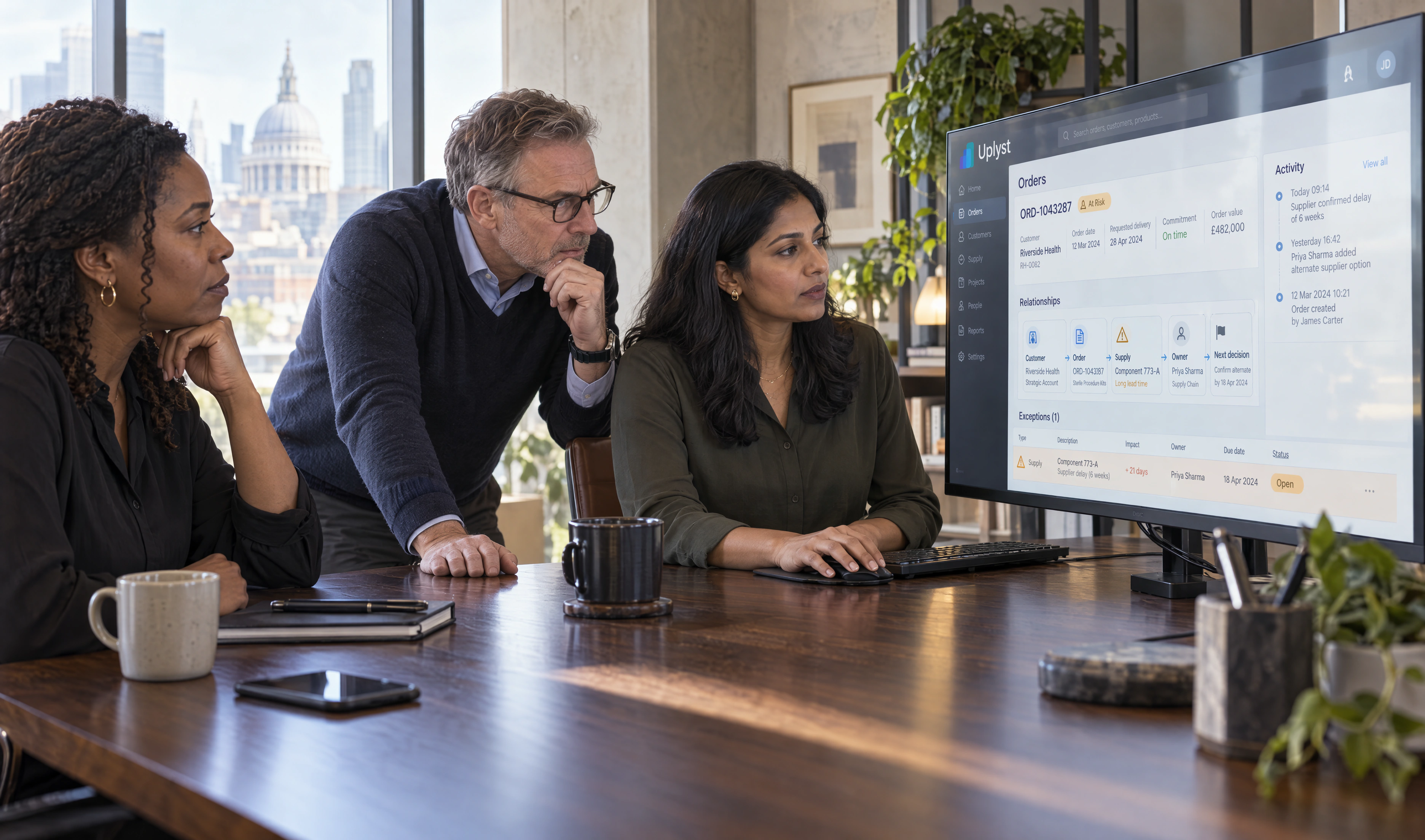 Business and data specialists examine a shared enterprise intelligence view in a working session