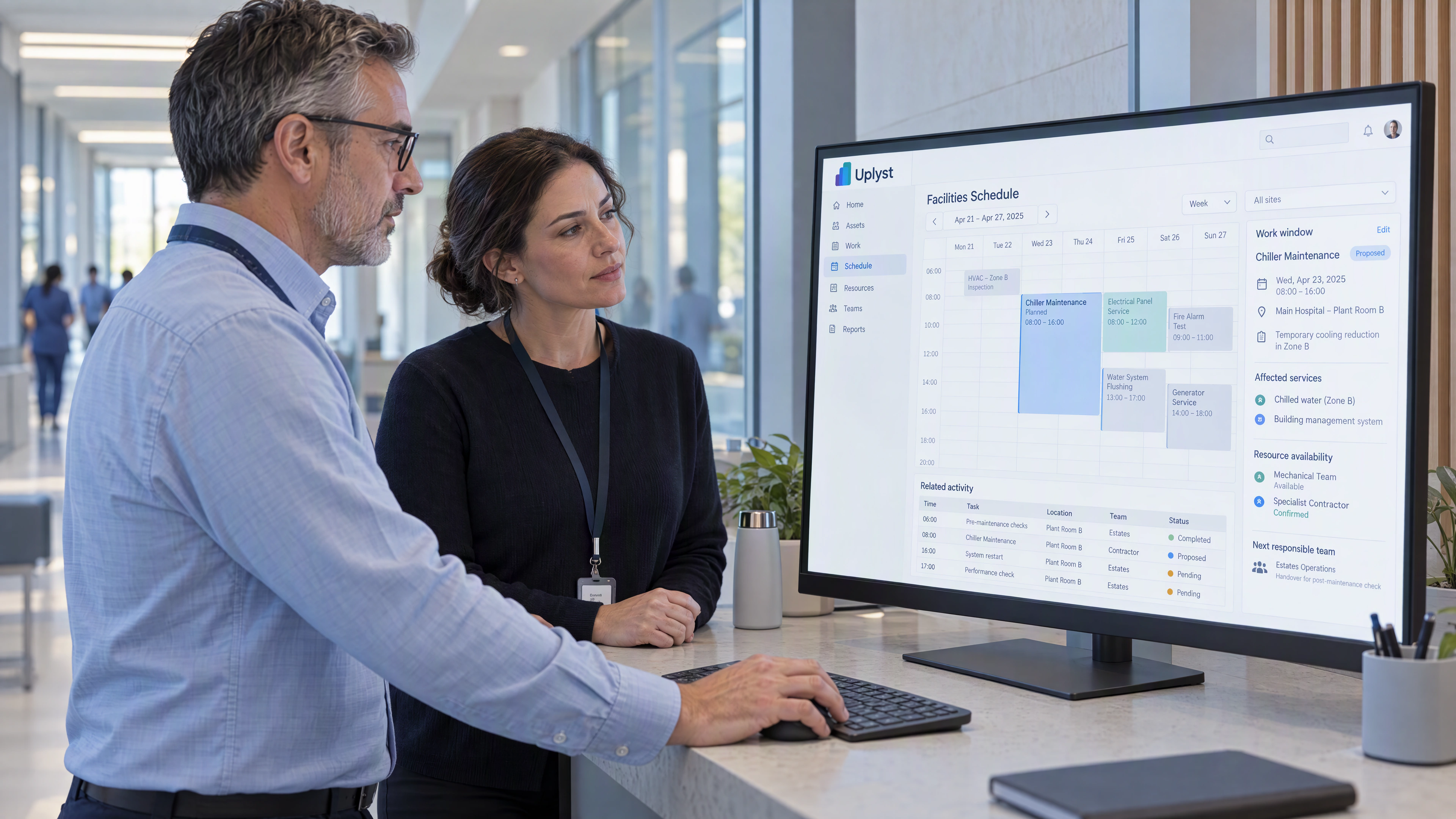 A service manager and estates planner review a work window against the operating schedule.