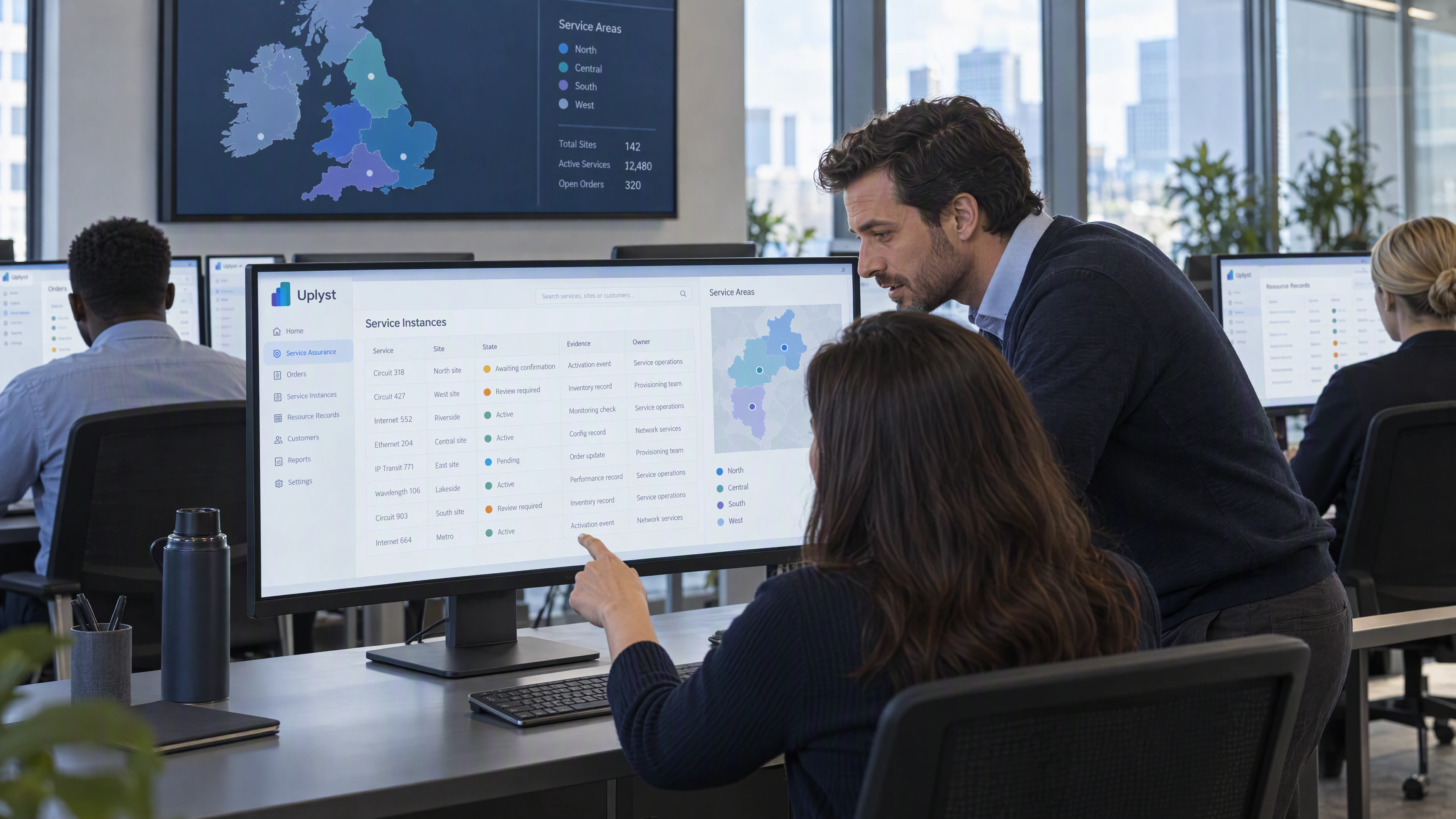 A service assurance team reviews customer and operating service information.
