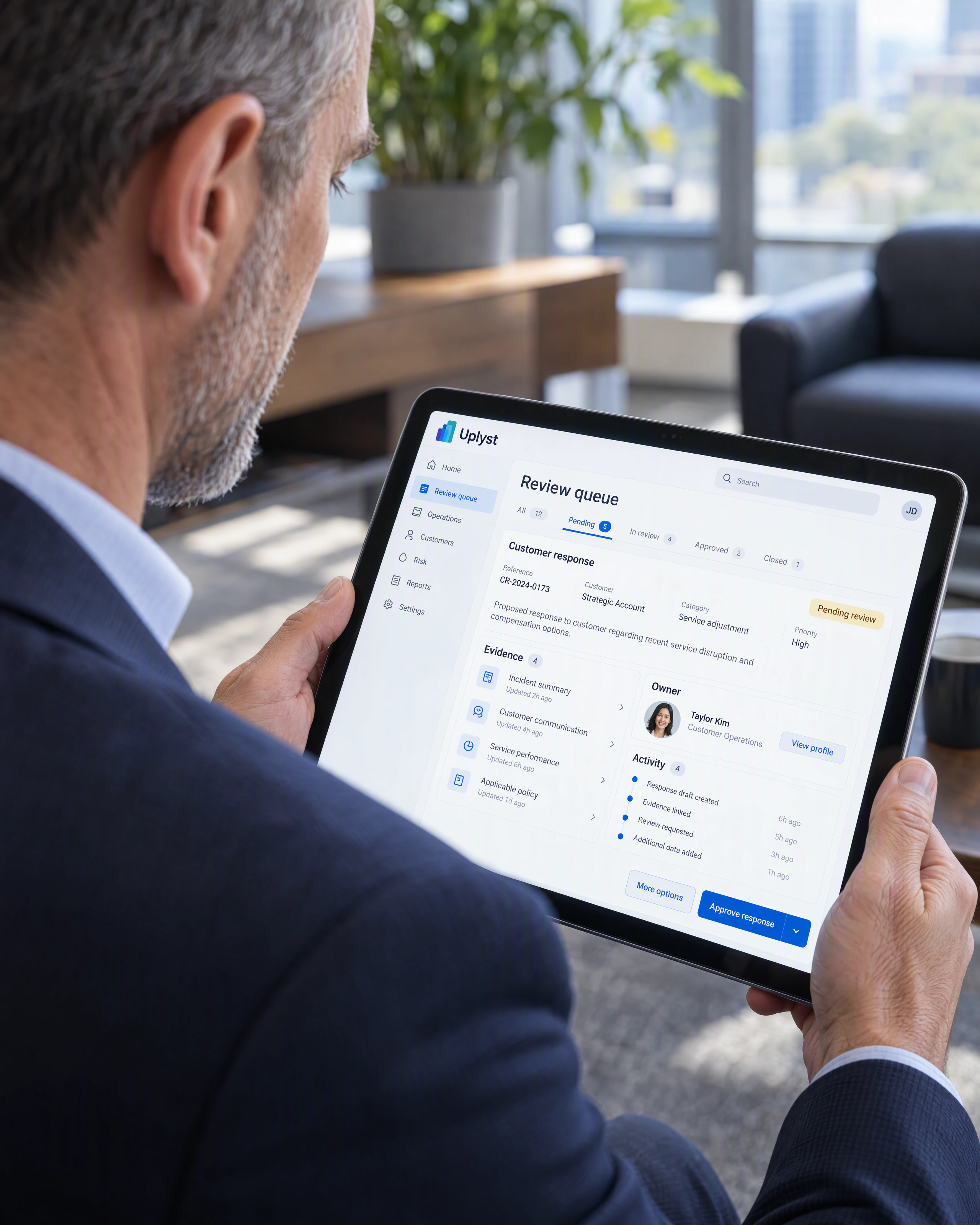 An operations director reviews the evidence and ownership of a proposed business response on a tablet.