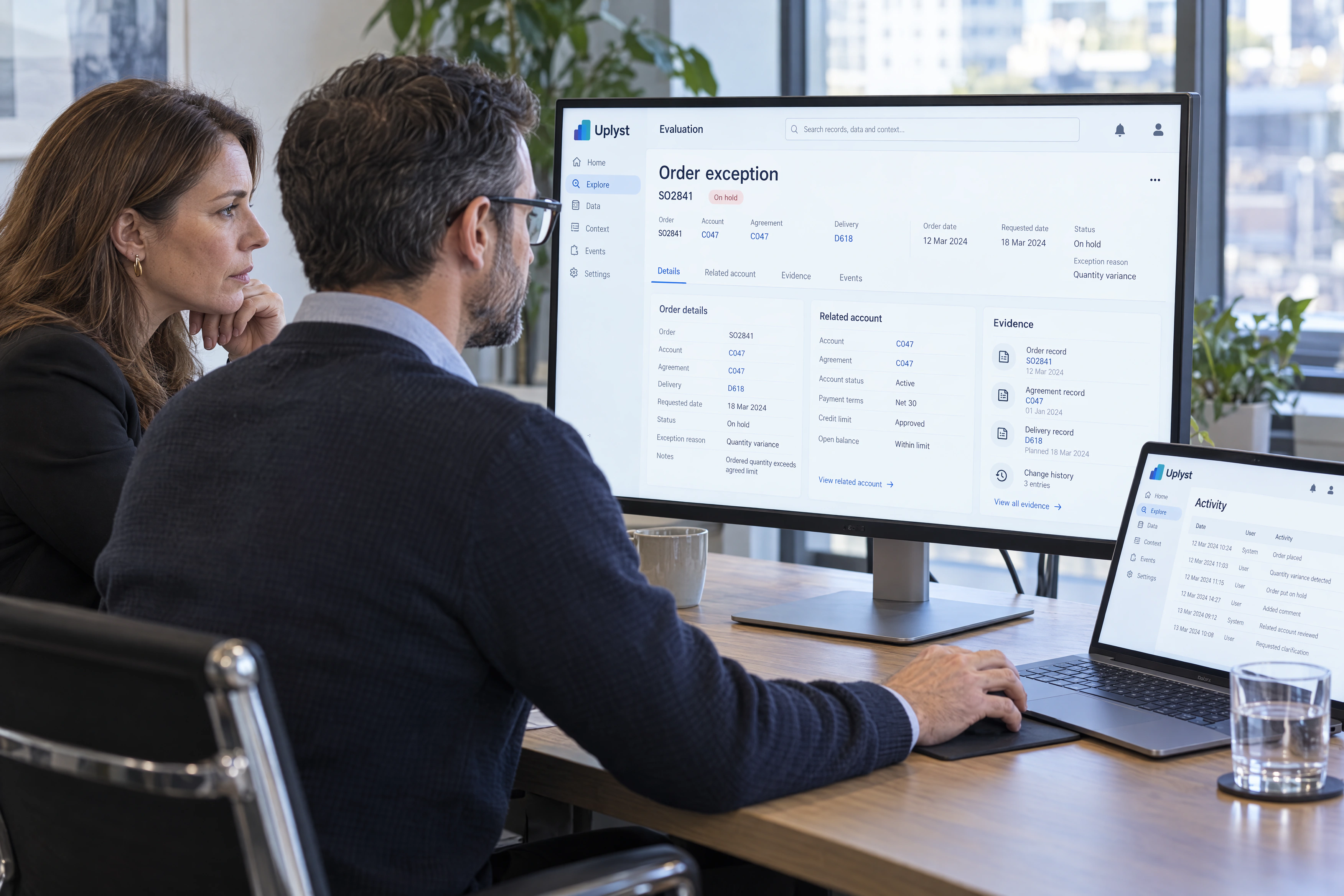 A business sponsor and solution architect examine an order exception during a focused platform evaluation.