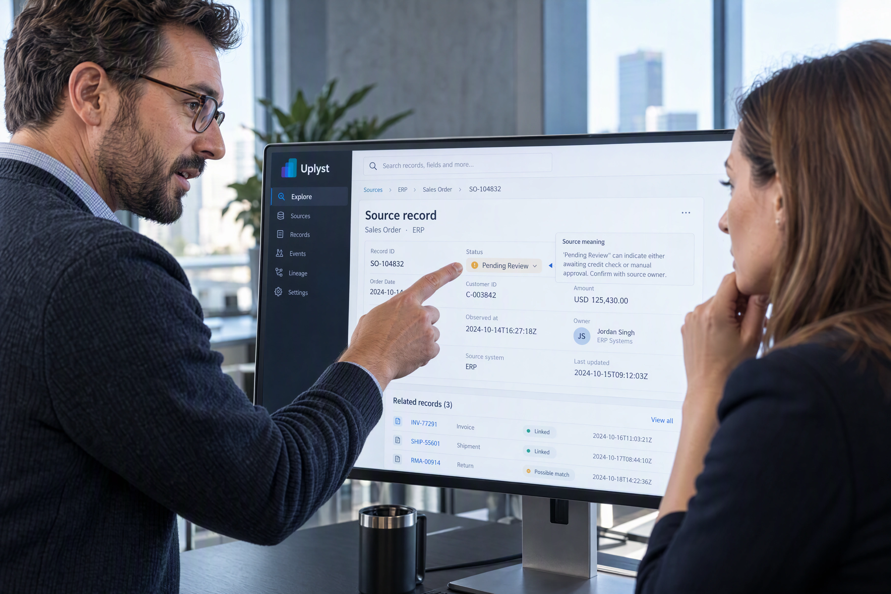 A source system owner explains a record’s status, ownership and timestamps to an evaluation lead.