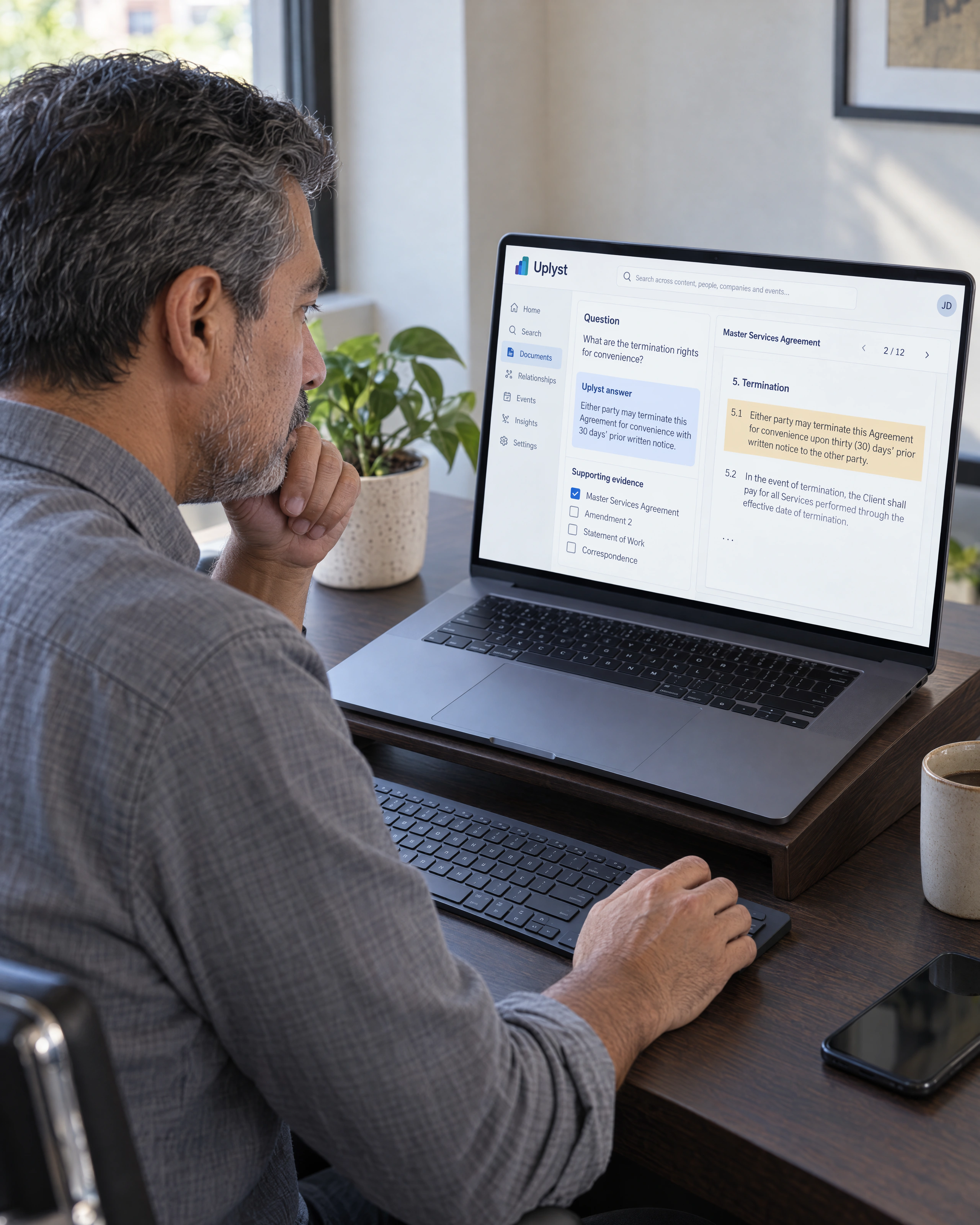 An evaluator examines an answer alongside the contract evidence and review criteria.