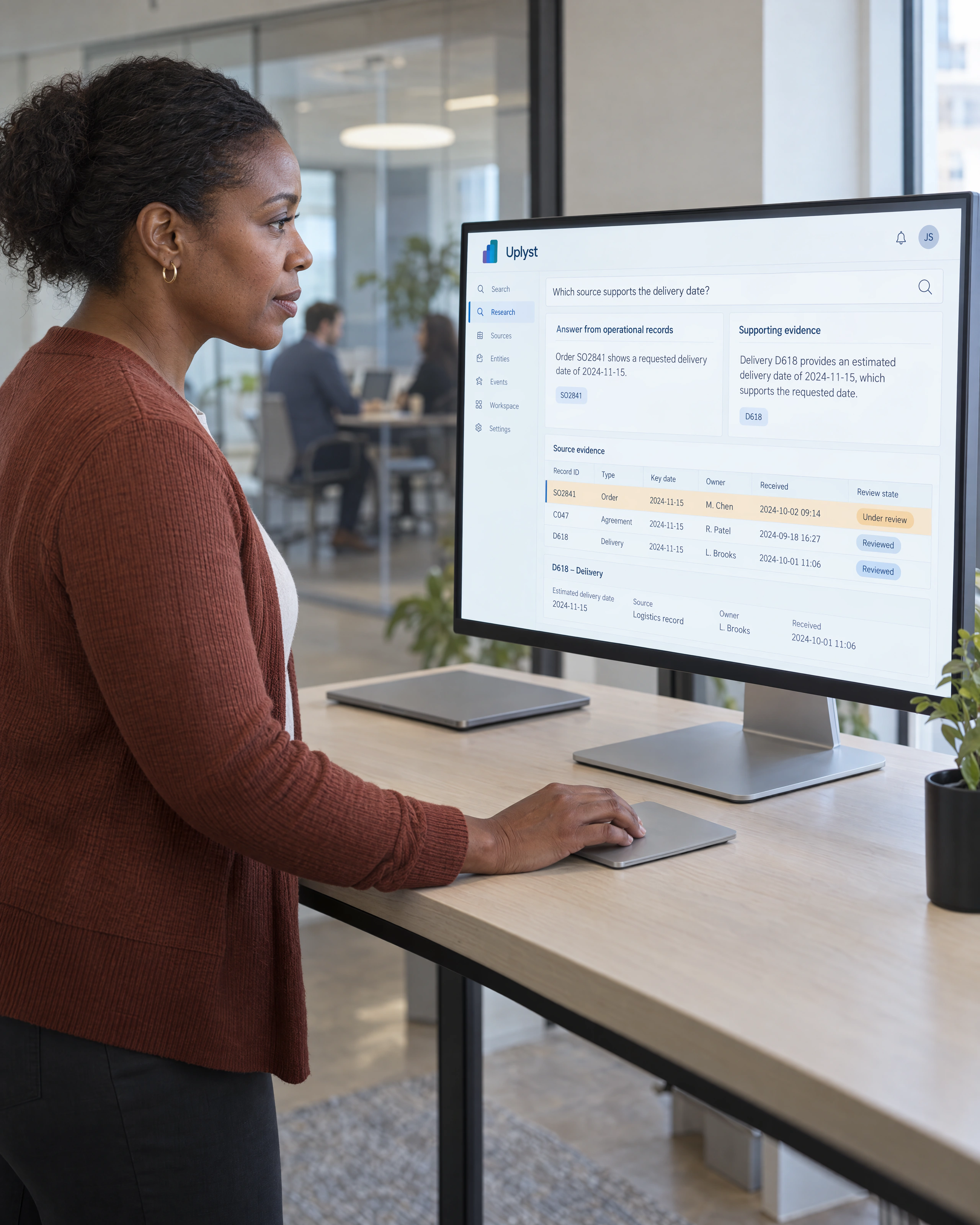 A researcher checks proposed explanations against supporting business records.