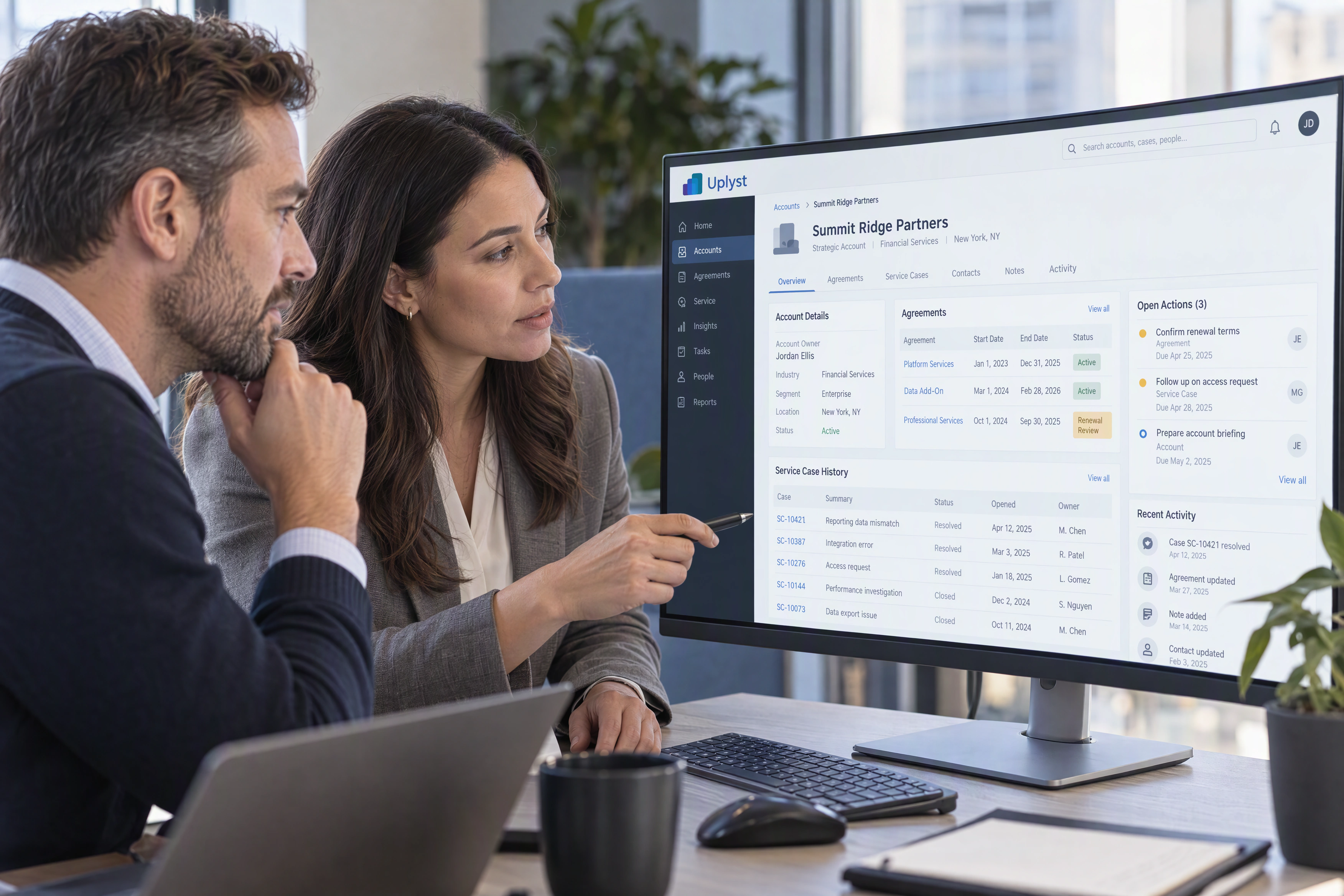 An account director and service lead prepare a customer conversation using the account, agreement and service history.
